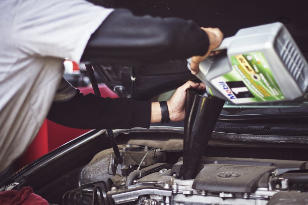 Engine oil being poured during servicing