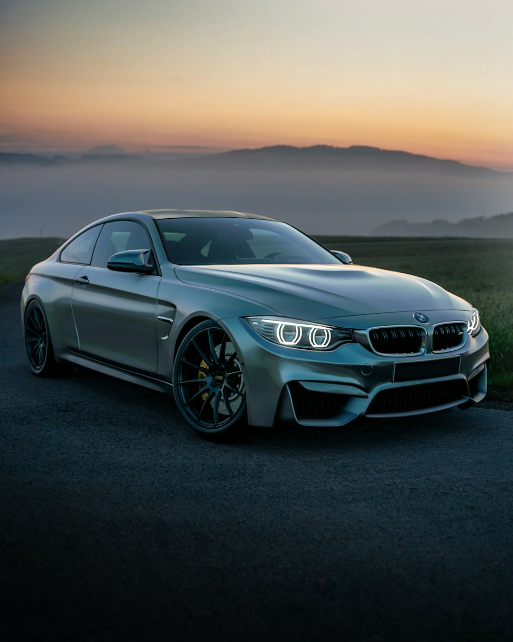 Grey coupe at dusk
